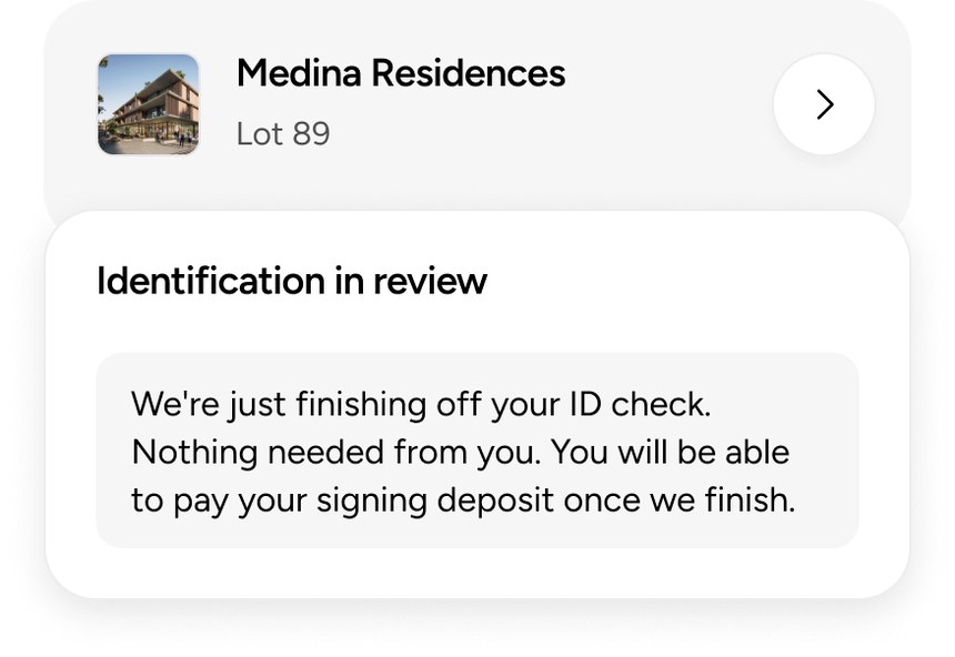 An off-the-plan lot card marked “Identification in review”, saying the signing deposit can be paid once the check finishes.